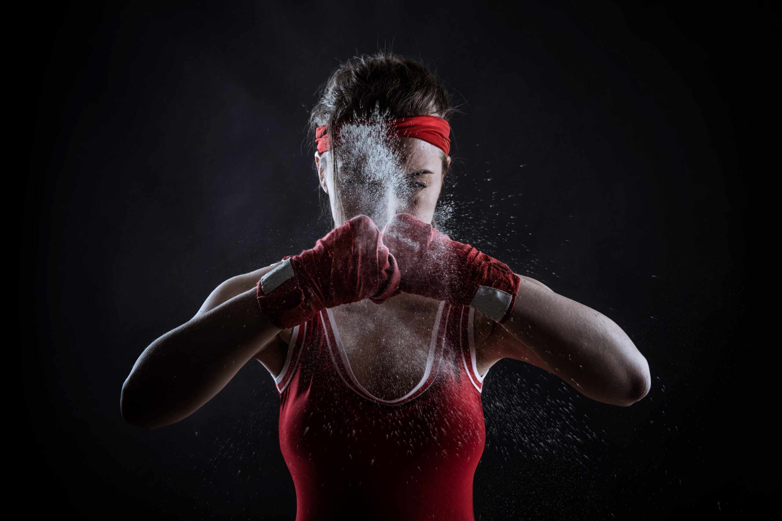 Female athlete in boxing bandages and sportswear